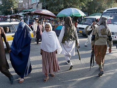 Two Taliban soldiers patrol the city center of Kabul, on September 1, 2021.  