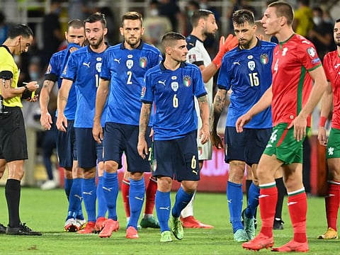 Italy's midfielder Marco Verratti (centre) and teammates react at the end of the FIFA World Cup Qatar 2022 qualifying round Group C football match against Bulgaria at the Artemio-Franchi stadium in Florence.