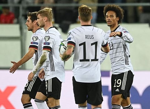 Germany's midfielder Leroy Sane (right) celebrates with teammates scoring during the FIFA World Cup Qatar 2022 qualification Group J football against Liechtenstein at the Kybunpark in St. Gallen, Switzerland.