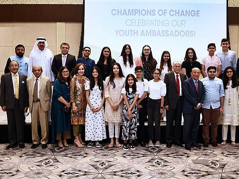Fifteen Pakistan youth ambassadors in UAE pose for a picture with officials at the Youth Ambassadors Certificate Ceremony on 2nd September, 2021. 