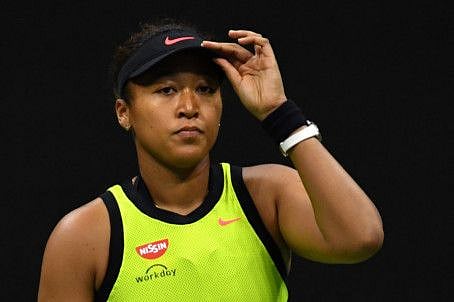 Japan's Naomi Osaka reacts during her 2021 US Open Tennis tournament women's singles third round match against Canada's Leylah Fernandez at the USTA Billie Jean King National Tennis Center in New York.