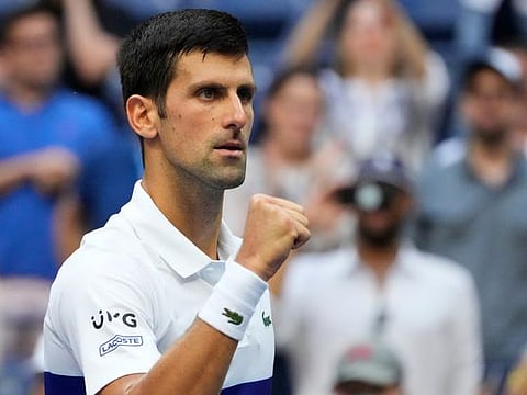 Novak Djokovic of Serbia celebrates after beating Kei Nishikori of Japan in the third round of the 2021 U.S. Open at USTA Billie Jean King National Tennis Center.