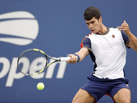 Carlos Alcaraz of Spain returns against Peter Gojowczyk of Germany during his mens Singles round of 16 match on Day Seven at USTA Billie Jean King National Tennis Center in New York City.