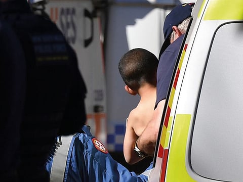 Three-year-old AJ Elfalak is carried by a paramedic into an ambulance after he is found alive on the family property near Putty, north west of Sydney,  on September 6, 2021.  