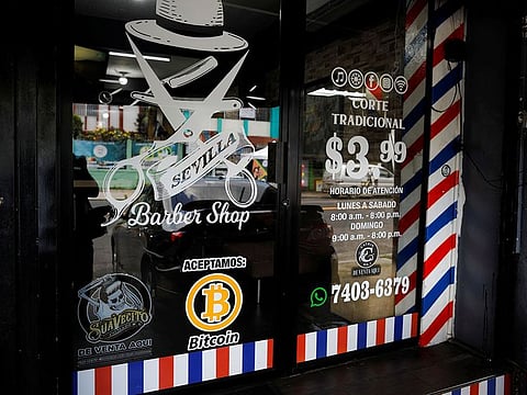 A Bitcoin logo is seen outside at Sevilla Barber Shop where Bitcoin is accepted as a payment method in Santa Tecla, El Salvador.