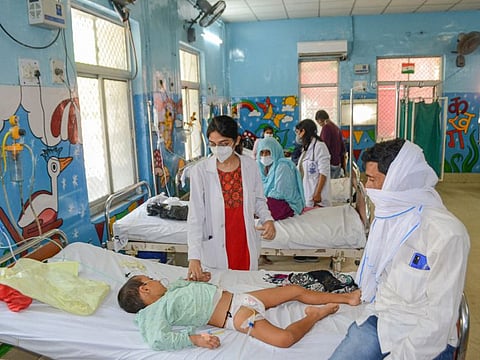 A doctor treats a child suffering from viral fever. Picture for illustrative purpose.