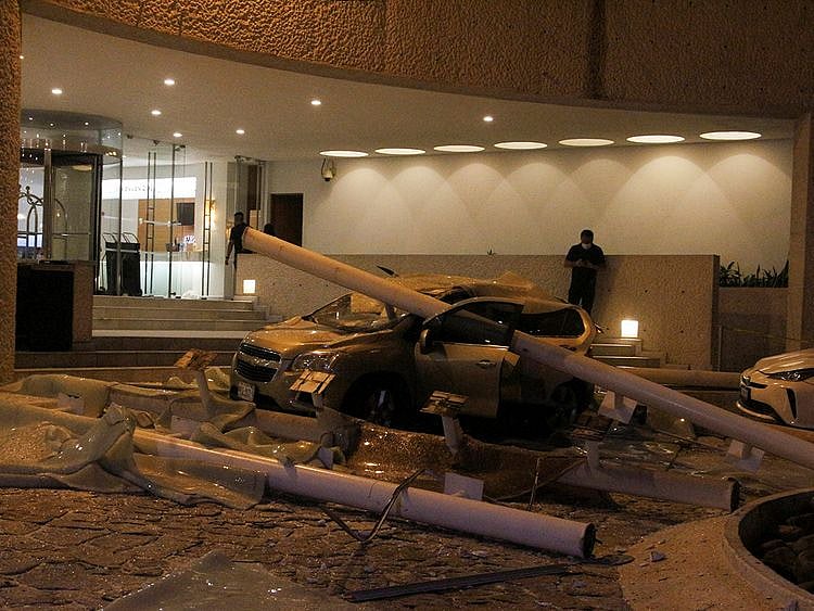  A car damaged during a quake is pictured at the Hotel Emporio in Acapulco on September 7, 2021.  