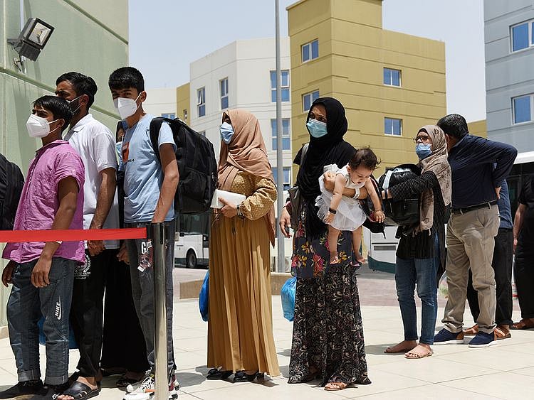 Evacuees from Afghanistan arrive at Emirates Humanitarian City in Abu Dhabi, on August 28, 2021. 