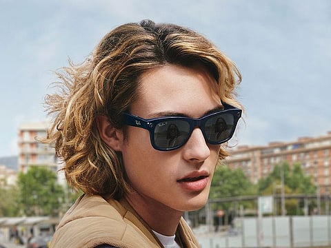 A model wearing smart glasses by Facebook and Ray Ban.