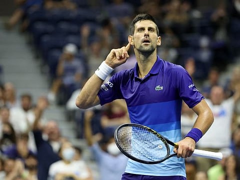 Novak Djokovic of Serbia reacts to the crowd as he plays against Matteo Berrettini of Italy during his Men's Singles quarterfinal match of the US Open at the USTA Billie Jean King National Tennis Center, New York City. 