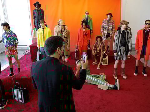 A person captures models as they present creations from the TEDDY VONRANSON Spring/Summer 2022 collection at New York Men's Day during New York Fashion Week in Manhattan, New York City, U.S., September 8, 2021. REUTERS/Andrew Kelly
