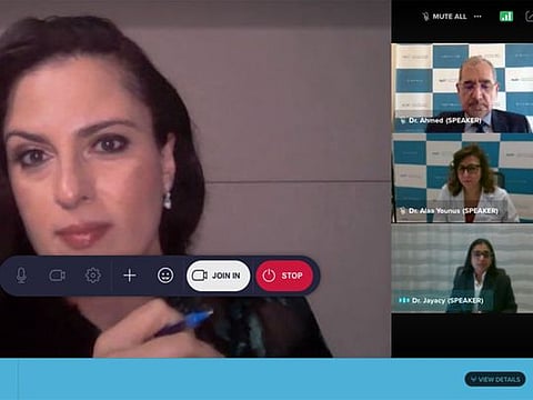 Dr Ahmed Hassoun (top right), Dr Alaa Younus Mohammed (centre right), Dr Jayacy Chandrassery Jayankar (bottom right) during the webinar, with Gulf News host Sally Mousa. 