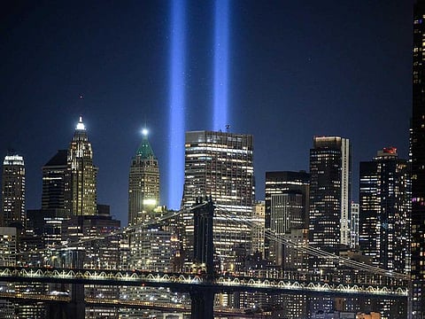 A general view of the city skyline and the 'Tribute in Light' installation commemorating the 9/11 terrorist attacks, in New York on September 10, 2021. 