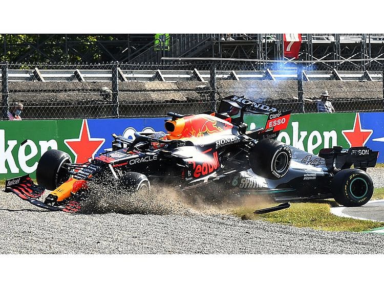 Red Bull's Max Verstappen crashes over Mercedes' Lewis Hamilton during the Italian Grand Prix 
