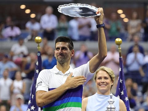 Serbia's Novak Djokovic holds his trophy after losing the 2021 US Open men's final against Russia's Daniil Medvedev at the USTA Billie Jean King National Tennis Center in New York.