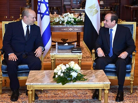 A handout picture released by the Egyptian Presidency on September 13, 2021, shows Egyptian President Abdel Fattah Al Sisi (right) meeting with Israeli Prime Minister Naftali Bennett in the Egyptian Red Sea resort town of Sharm El Sheikh. 