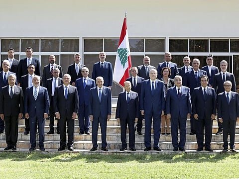 Members of the new government pose for an official picture at the Presidential Palace in Baabda, east of Beirut, on Monday.