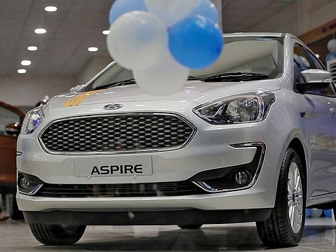 A new Ford Aspire hatchback seen at a New Delhi showroom.