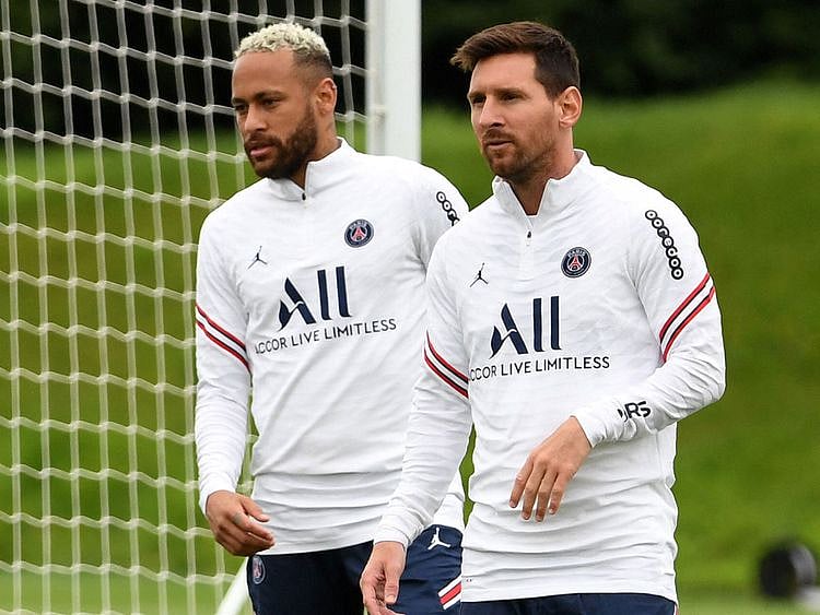 Paris Saint-Germain's Lionel Messi in training with teammate Neymar