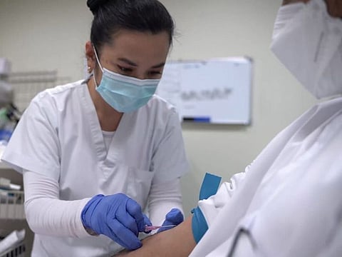 A nurse at SKMC, Abu Dhabi, working with a patient receiving Sotrovimab.