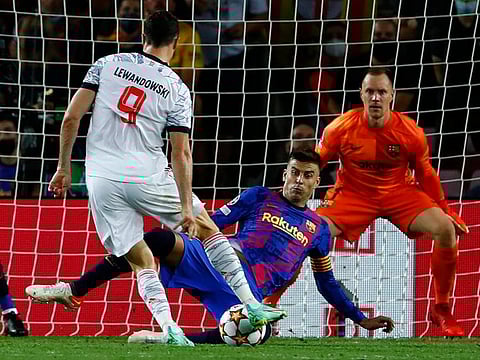 Bayern’s Robert Lewandowski scores his side’s third against Barcelona.