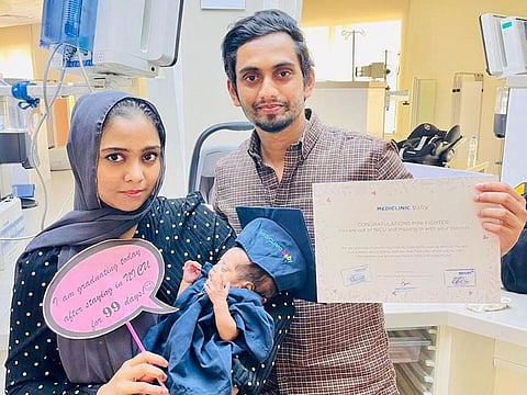 Fathima Shafa with her husband Mohamed Ziyan and their newborn Aiza who was discharged from the Mediclinic Parkview Hospital in Dubai on Monday - 99 days after she was in the ICU.