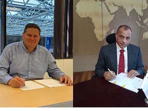 Steve Hoffman, Chevron Brands International Officer, and Eugene Mayne, Tristar Group CEO signing the agreement from miles away