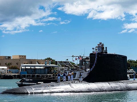 In this photo provided by US Navy, the Virginia-class fast-attack submarine USS Illinois (SSN 786) returns home to Joint Base Pearl Harbor-Hickam from a deployment in the 7th Fleet area of responsibility on Sept. 13, 2021. Australia decided to invest in US nuclear-powered submarines and dump its contract with France to build diesel-electric submarines because of a changed strategic environment, Prime Minister Scott Morrison said on Thursday, Sept. 16, 2021.  