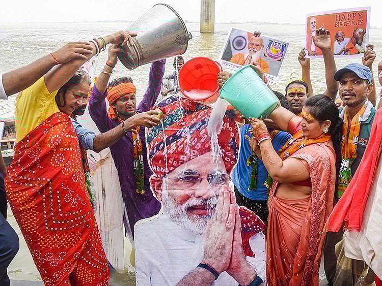 BJP supporters perform rituals on the banks of river Ganga