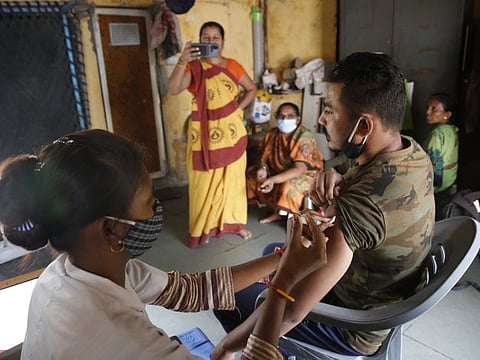 A health worker administers a vaccine during a special vaccination drive in Ahmedabad, on September 17, 2021. 