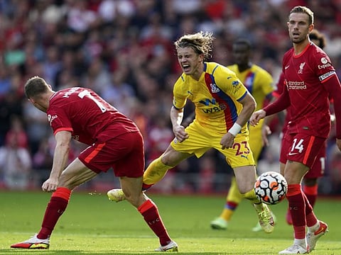 Liverpool's James Milner (left) vies for the ball with Crystal Palace's Conor Gallagher during their English Premier League match at Anfield Stadium, Liverpool, England.
