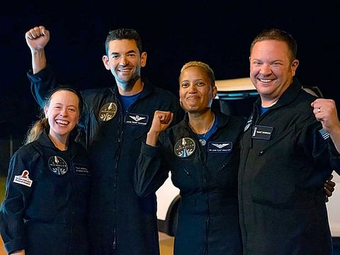 In this image released by Inspiration4, passengers aboard a SpaceX capsule, from left to right, Hayley Arceneaux, Jared Isaacman,  Sian Proctor and Chris Sembroski pose after the capsule was recovered following its splashdown in the Atlantic off the Florida coast, Saturday, Sept. 18, 2021. The all-amateur crew was the first to circle the world without a professional astronaut.  