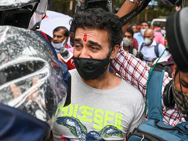 Bollywood actress Shilpa Shetty's husband Raj Kundra (C), surrounded by media, leaves after being released on bail from the central jail for allegedly producing and broadcasting pornographic films online, in Mumbai on September 21, 2021.