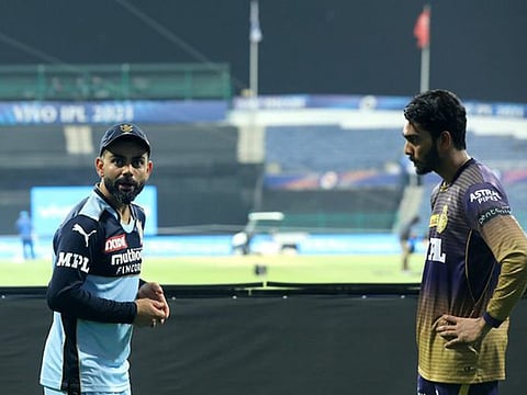 All ears: Venkatesh Iyer (right), the Kolkata Knight Riders debutant, catches up with Royal Challengers Bangalore captain Virat Kohli for tips on his craft after their win in Abu Dhabi on Monday.