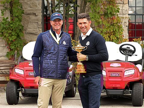 US Ryder Cup captain Steve Stricker greets European captain Padraig Harrington in Wisconsin.