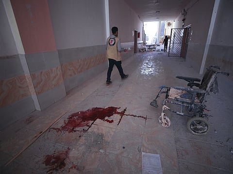 In this March 22, 2021, file photo, blood splatters the floor of a hospital in Atareb, a town in rural western Aleppo, Syria. Artillery shells fired from government areas killed at least five civilians and wounded medical staff when they landed in front of the hospital. Countries like Lebanon, Syria, Iraq, Lebanon and Yemen are all teetering on the brink of humanitarian catastrophe with an economic implosion that threatens to throw the region into even deeper turmoil. 