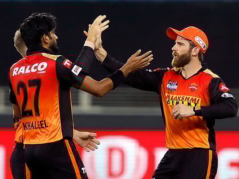 Sunrisers Hyderabad captain Kane Williamson and Khaleel Ahmed celebrate the wicket of Prithvi Shaw of Delhi Capitals in the IPL match at the Dubai International Stadium on September 22, 2021.