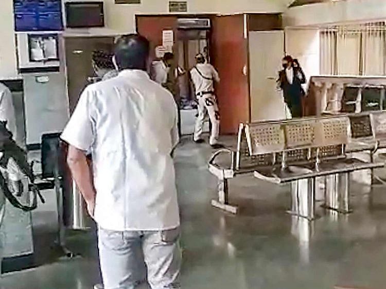 Security personnel during a shootout at the Rohini Court, where gangster Jitender Gogi was being produced, in New Delhi, on September 24, 2021. Gogi was killed by rival gang shooters who were later shot down by the police in the cross-firing. 