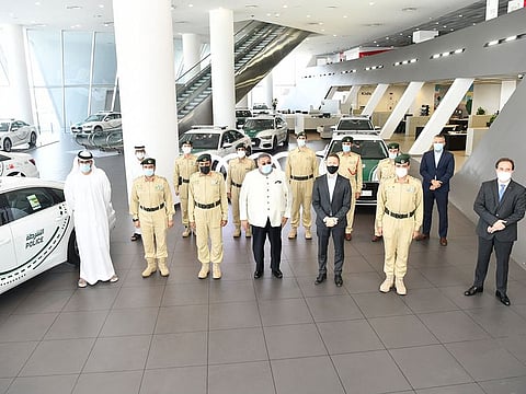 Police officials and Nabooda Automobiles representatives with the new Audi cars 