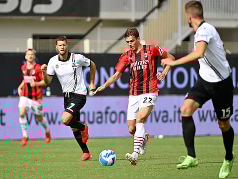 AC Milan's Italian forward Daniel Maldini (centre) controls the ball during the Italian Serie A match against Spezia at the Alberto-Picco stadium in La Spezia.