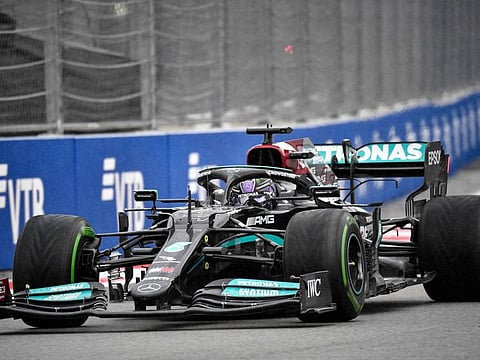 Mercedes' British driver Lewis Hamilton steers his car to win the Formula One Russian Grand Prix at the Sochi Autodrom circuit in Sochi.