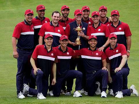 Team USA poses for a picture after the Ryder Cup matches at the Whistling Straits Golf Course Sunday.