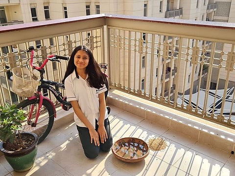 Umme Kulsum Saif in her Dubai apartment's balcony where she cares for birds 
