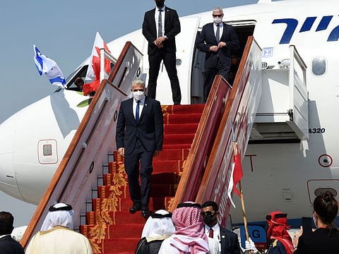 Israeli Foreign Minister Yair Lapid disembarks upon arrival at the Bahrain International Airport, on September 30, 2021. 