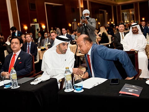 Thani Al Zeyoudi, UAE Minister of Foreign Trade, with Javed Malik, President of Diplomat Business Club (to his right) and Paras Shahdadpuri of Nikai Group.