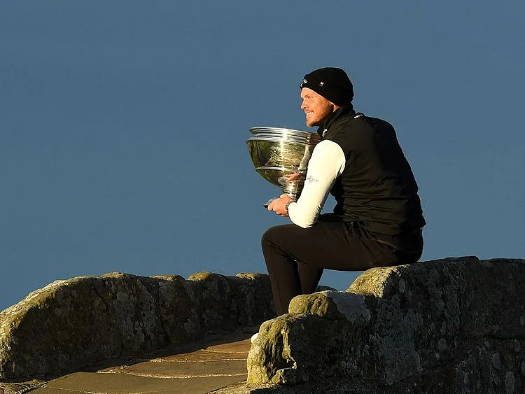Danny willet celebrates on the famous St Andrews Old Course bridge after the Alfred Dunhill Links Championship