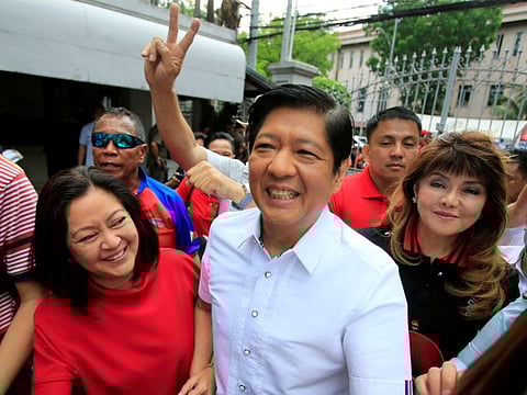 Ferdinand "Bongbong" Marcos, his wife, Louise (left) and his sister Imee upon arrival at the Supreme Court in Padre Faura, Metro Manila in a 2018 file photo.