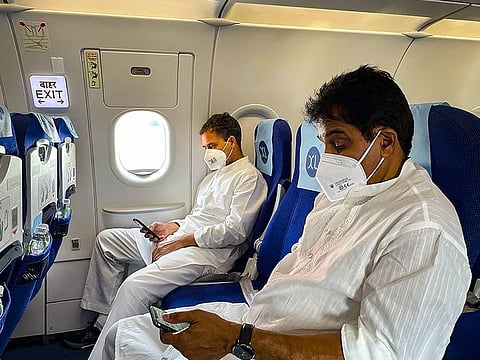  Congress leaders Rahul Gandhi (left), onboard a flight to Lucknow, UP, to meet families of farmers who lost their lives in Lakhimpur Kheri violence, in New Delhi, on October 6, 2021. 