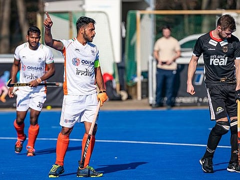 Harmanpreet Singh, leader of Indian men's hockey team in midfield (centre), said team work was the key behind their recognition. 