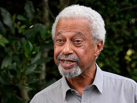 Tanzanian writer Abdulrazak Gurnah gestures as he poses for a photo at his home in Canterbury, England, Thursday, Oct. 7, 2021. Gurnah was awarded the Nobel Prize for Literature on Thursday. The Swedish Academy said the award was in recognition of his "uncompromising and compassionate penetration of the effects of colonialism." 